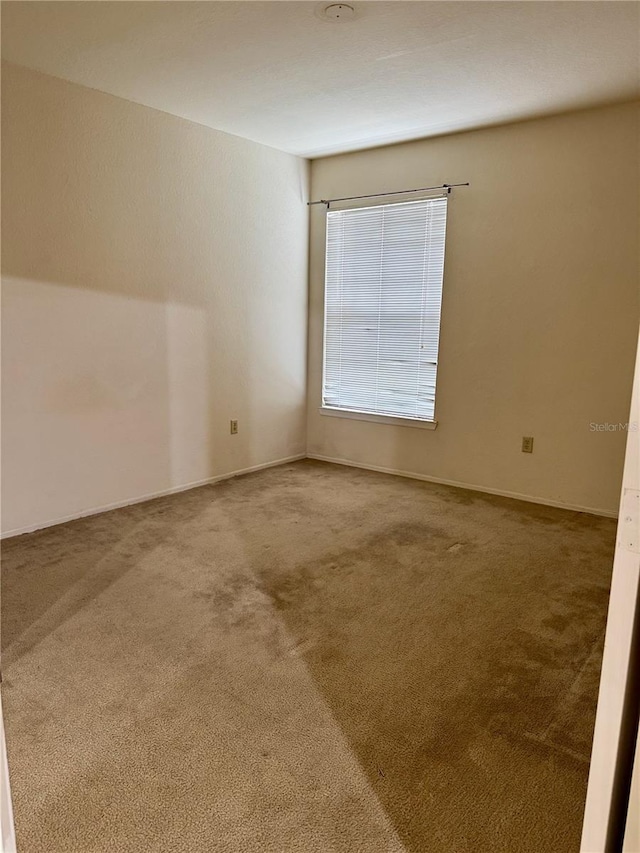 107 Vista Verdi Cir Unit 121, Lake Mary, FL 32746 - carpeted empty room with baseboards