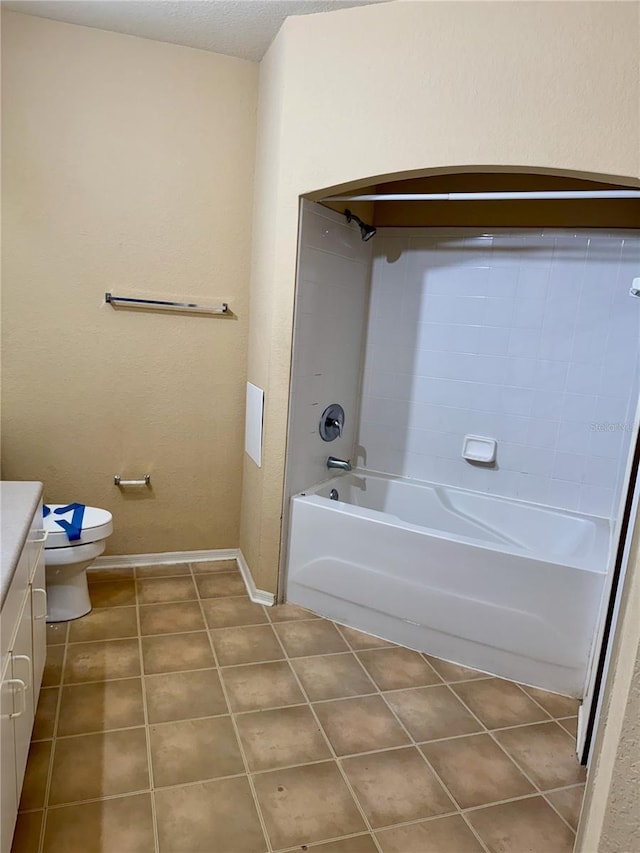107 Vista Verdi Cir Unit 121, Lake Mary, FL 32746 - bathroom with vanity, baseboards, tile patterned floors, toilet, and tub / shower combination