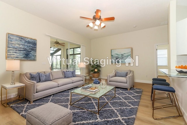 3835 Rock Hill Loop, Apopka, FL 32712 - living room featuring baseboards, wood finished floors, and a ceiling fan