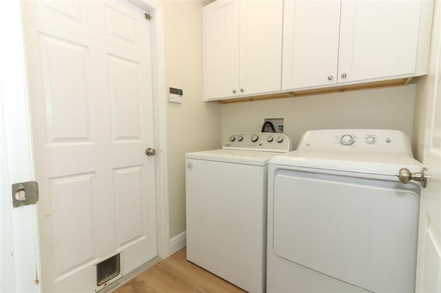 3835 Rock Hill Loop, Apopka, FL 32712 - laundry area with light wood-style flooring, cabinet space, visible vents, baseboards, and independent washer and dryer