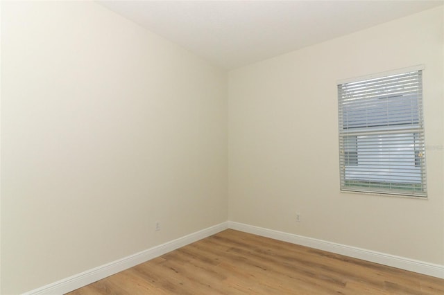 3835 Rock Hill Loop, Apopka, FL 32712 - empty room featuring baseboards and light wood-style floors