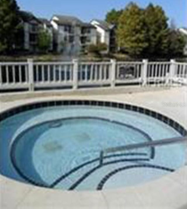 view of pool featuring a community hot tub