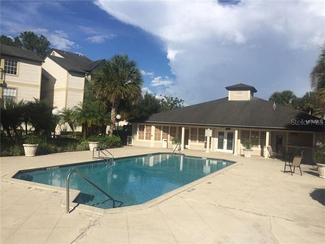 pool featuring a patio and french doors