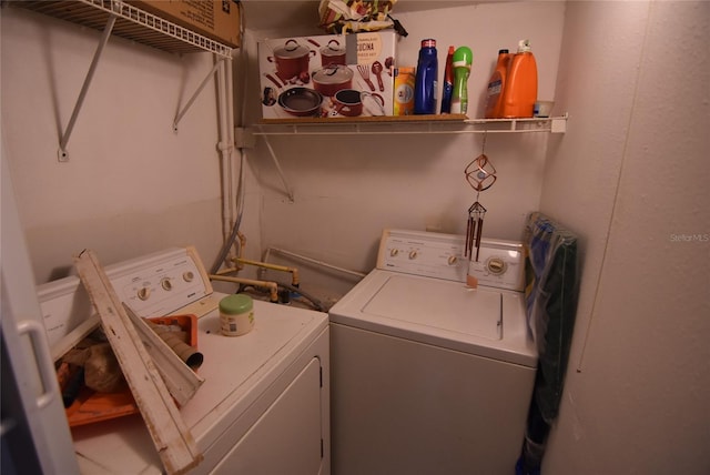 laundry room with independent washer and dryer and laundry area