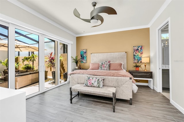 2172 Sherbrook Ave, Davenport, FL 33837 - bedroom with ornamental molding, access to exterior, multiple windows, and wood finished floors