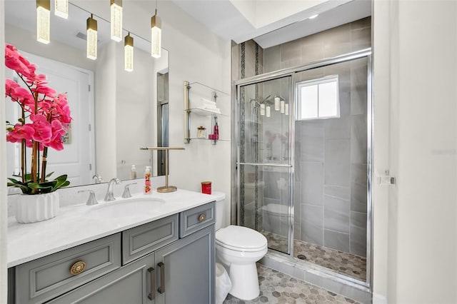 2172 Sherbrook Ave, Davenport, FL 33837 - bathroom with toilet, a stall shower, and vanity