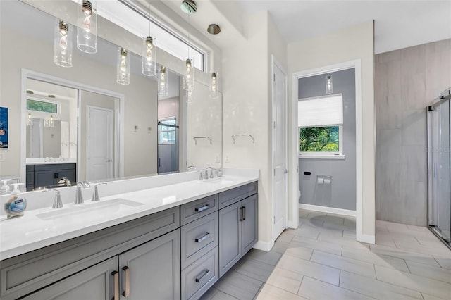 2172 Sherbrook Ave, Davenport, FL 33837 - bathroom with a sink, double vanity, and a stall shower