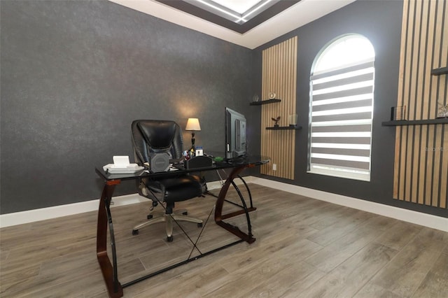 office area with baseboards, a wealth of natural light, and wood finished floors