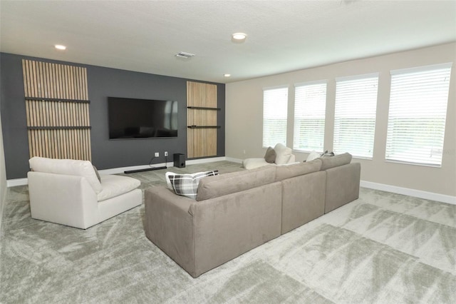 living area with recessed lighting, baseboards, visible vents, and carpet floors