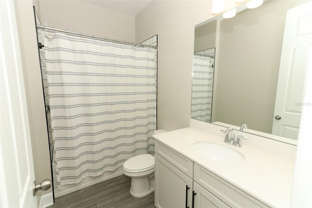 bathroom with shower / tub combo with curtain, vanity, toilet, and wood finished floors