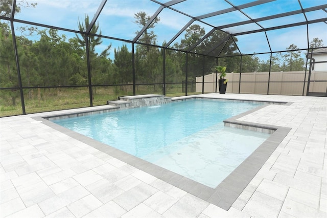 outdoor pool with a lanai and a patio area