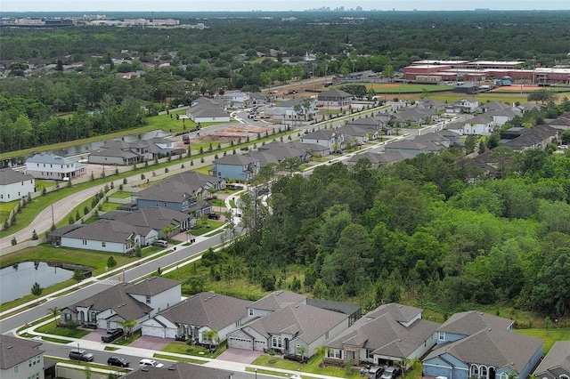 bird's eye view featuring a water view and a residential view