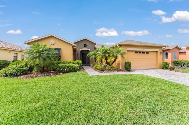 single story home featuring a front lawn, decorative driveway, a garage, and stucco siding