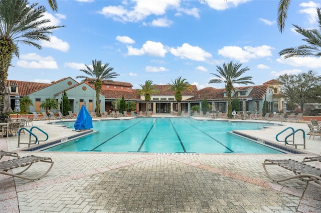 community pool with a patio area