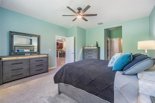 bedroom featuring visible vents, baseboards, a ceiling fan, and carpet floors