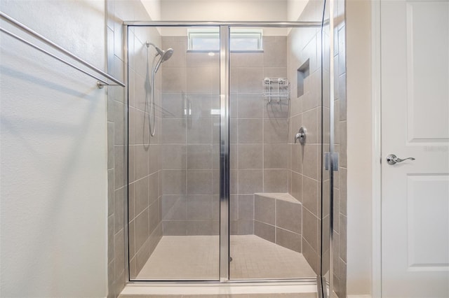 full bath featuring a shower stall