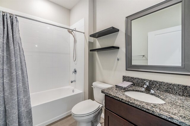 bathroom with shower / bath combo with shower curtain, vanity, and toilet