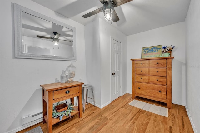 1110 Virginia Ave, Saint Cloud, FL 34769 - interior space with a baseboard radiator, a ceiling fan, wood finished floors, and baseboards