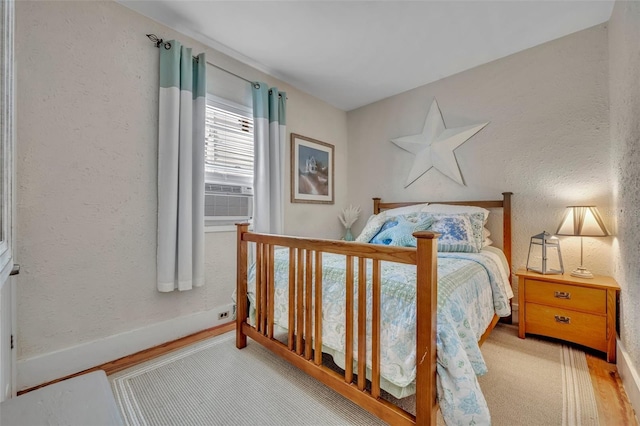 1110 Virginia Ave, Saint Cloud, FL 34769 - bedroom with cooling unit, a textured wall, and baseboards