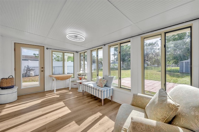 1110 Virginia Ave, Saint Cloud, FL 34769 - sunroom / solarium with a wooden deck, wood finished floors, and a healthy amount of sunlight