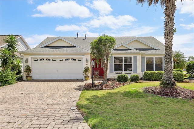 433 Arcadia Lakes Dr, The Villages, FL 32162 - single story home with a front lawn, a shingled roof, decorative driveway, and a garage