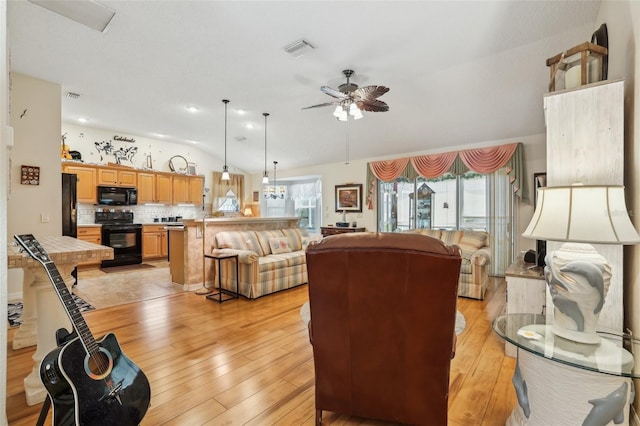 433 Arcadia Lakes Dr, The Villages, FL 32162 - living room featuring plenty of natural light, visible vents, ceiling fan, and lofted ceiling