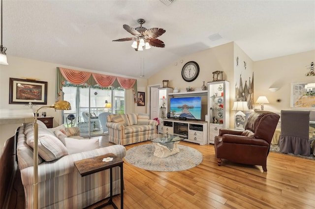 433 Arcadia Lakes Dr, The Villages, FL 32162 - living room with wood-type flooring, a ceiling fan, and lofted ceiling