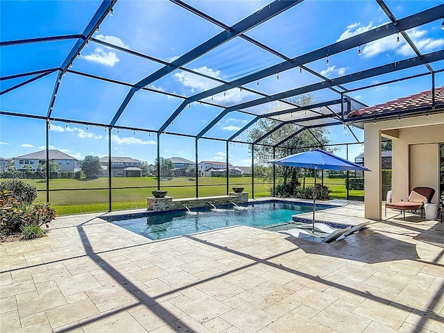 pool featuring a lanai, a patio area, and a lawn