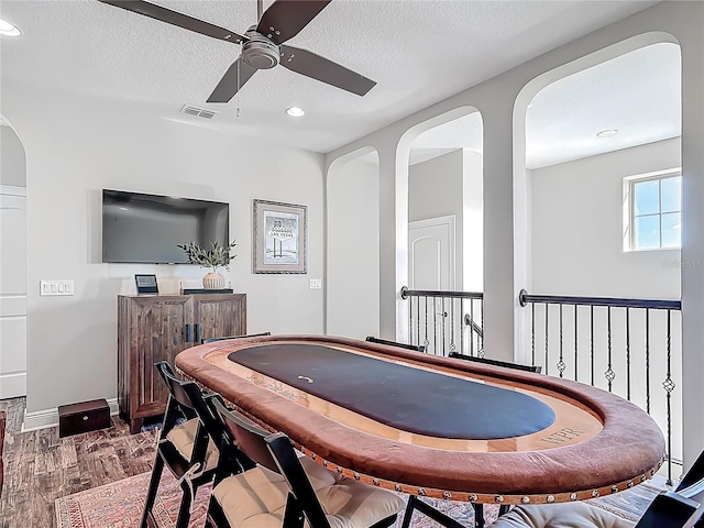recreation room with visible vents, a ceiling fan, recessed lighting, and a textured ceiling