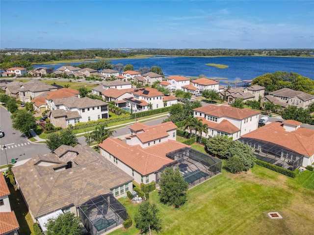 bird's eye view featuring a water view and a residential view