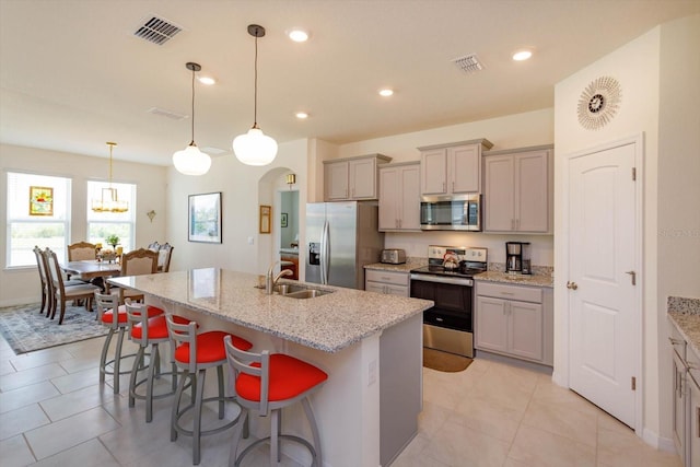 6960 Audobon Osprey Cv, Harmony, FL 34773 - kitchen featuring a sink, visible vents, gray cabinets, and stainless steel appliances