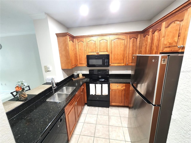 2528 Robert Trent Jones Dr Unit 1617, Orlando, FL 32835 - kitchen with brown cabinetry, light tile patterned floors, a sink, and black appliances