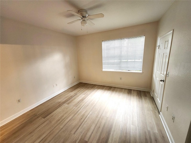 2528 Robert Trent Jones Dr Unit 1617, Orlando, FL 32835 - spare room with light wood-style flooring, baseboards, and a ceiling fan