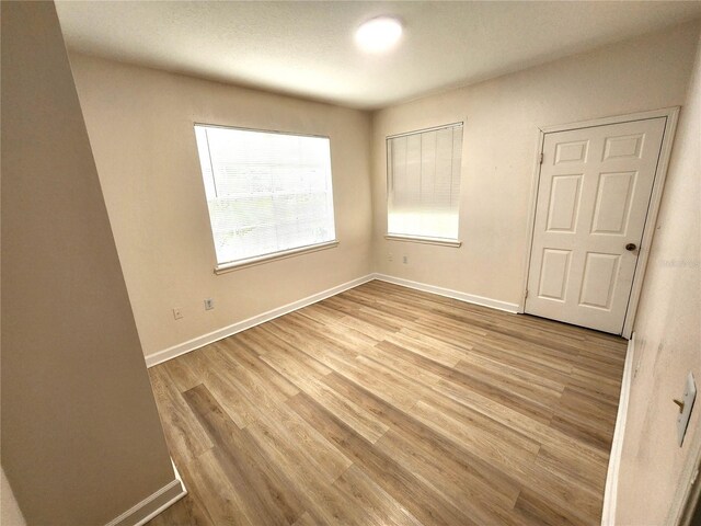 2528 Robert Trent Jones Dr Unit 1617, Orlando, FL 32835 - spare room with light wood-style floors and baseboards