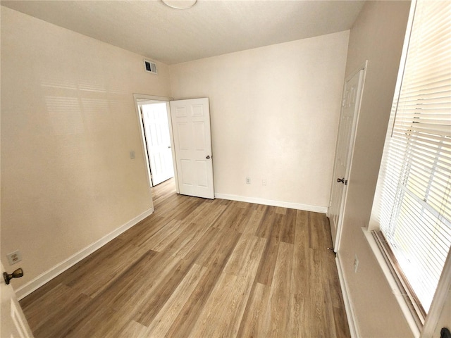 2528 Robert Trent Jones Dr Unit 1617, Orlando, FL 32835 - unfurnished bedroom with light wood finished floors, baseboards, and visible vents