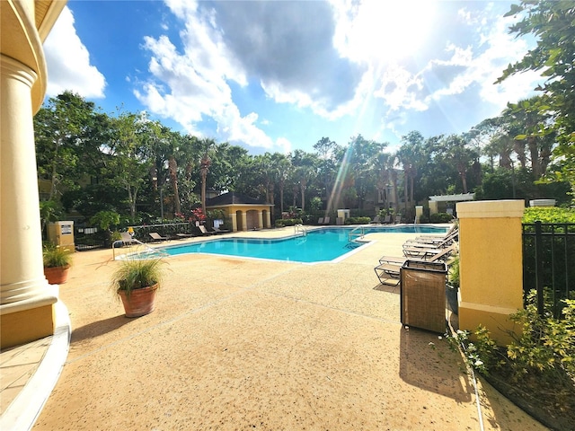 2528 Robert Trent Jones Dr Unit 1617, Orlando, FL 32835 - pool featuring a patio area and fence
