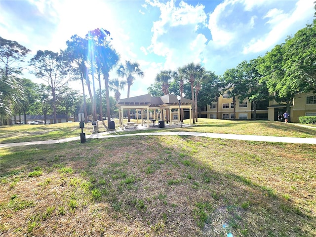 2528 Robert Trent Jones Dr Unit 1617, Orlando, FL 32835 - view of front facade featuring stucco siding and a front lawn