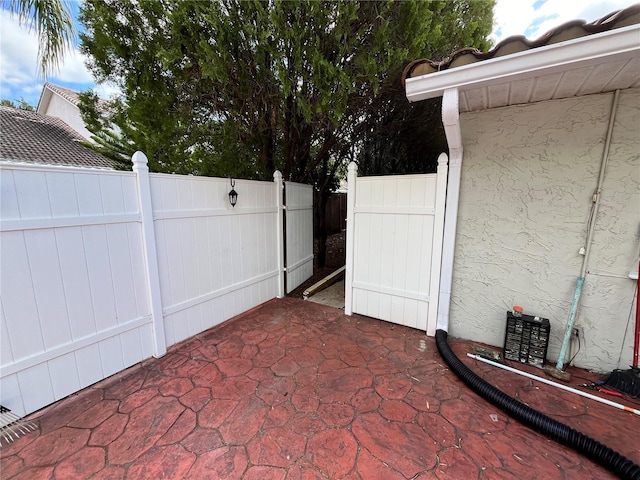 view of patio featuring fence