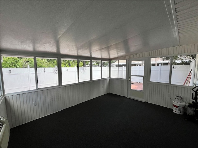 unfurnished sunroom featuring plenty of natural light