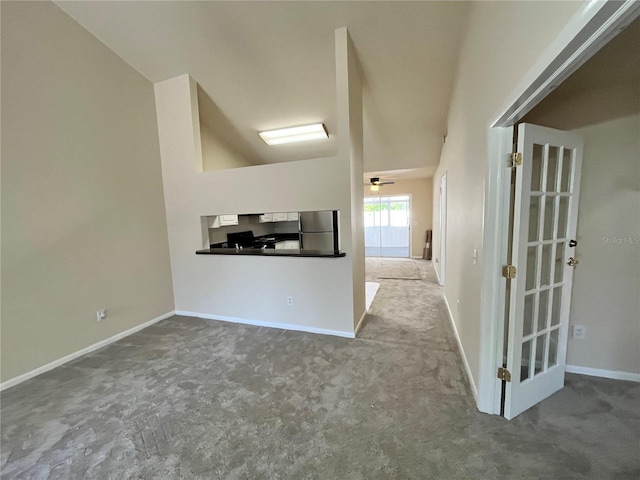 hall featuring carpet floors and baseboards