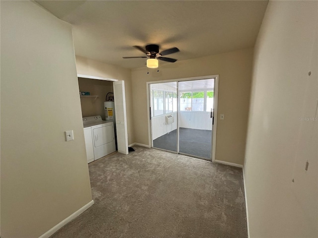 empty room with a ceiling fan, baseboards, water heater, carpet flooring, and washer and dryer