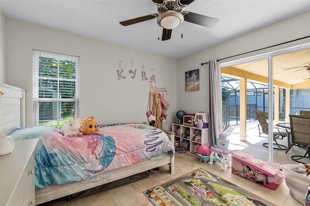 bedroom with a textured ceiling, access to exterior, and a ceiling fan