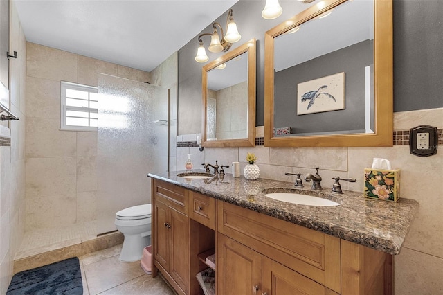 full bathroom with walk in shower, tile walls, a sink, and toilet