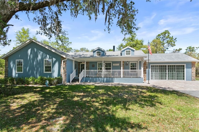 6330 Oil Well Rd, Clermont, FL 34714 - ranch-style house featuring driveway, an attached garage, covered porch, and a front lawn