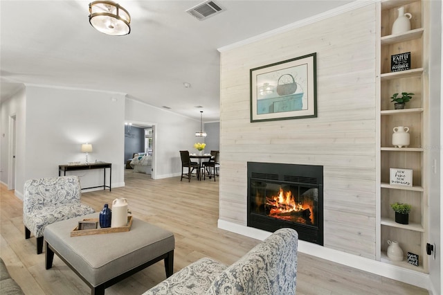 6330 Oil Well Rd, Clermont, FL 34714 - living room with baseboards, a large fireplace, crown molding, visible vents, and lofted ceiling