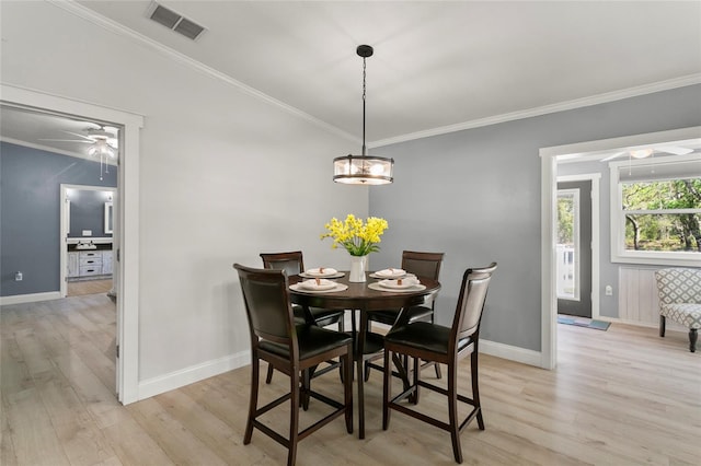 6330 Oil Well Rd, Clermont, FL 34714 - dining space featuring baseboards, visible vents, light wood-type flooring, and a ceiling fan