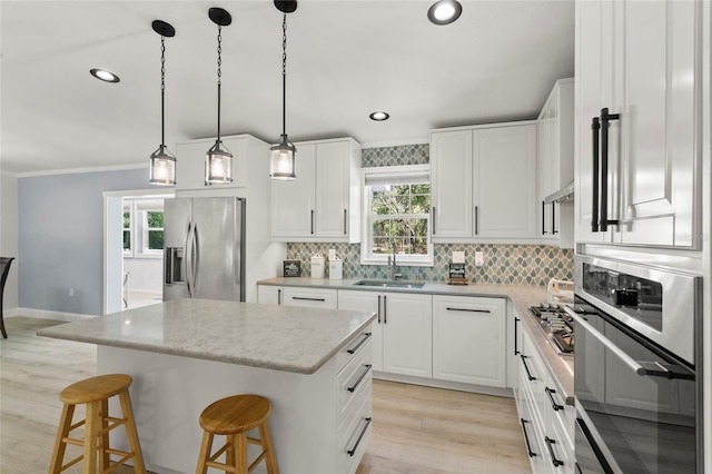6330 Oil Well Rd, Clermont, FL 34714 - kitchen with decorative backsplash, a kitchen island, a sink, and stainless steel appliances