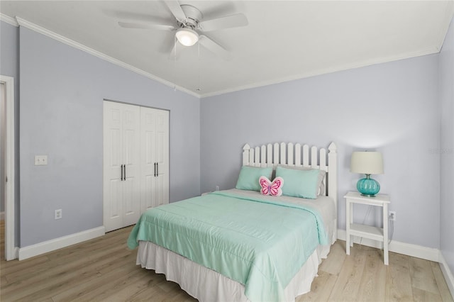 6330 Oil Well Rd, Clermont, FL 34714 - bedroom with a closet, baseboards, ornamental molding, a ceiling fan, and wood finished floors