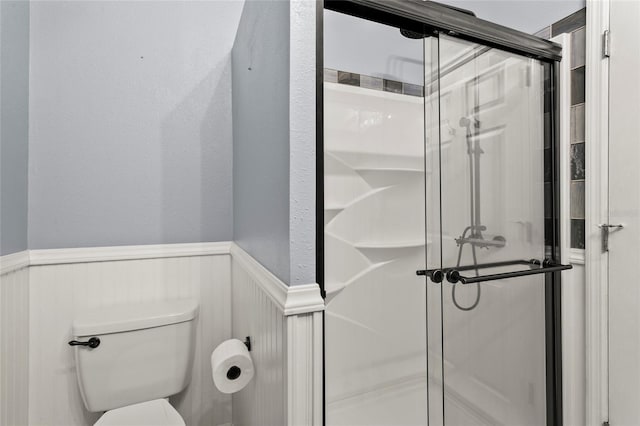 6330 Oil Well Rd, Clermont, FL 34714 - bathroom with toilet, a shower stall, and wainscoting