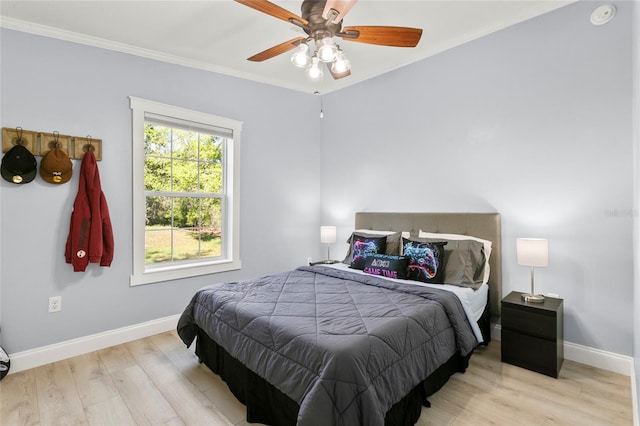 6330 Oil Well Rd, Clermont, FL 34714 - bedroom featuring crown molding, baseboards, light wood finished floors, and a ceiling fan